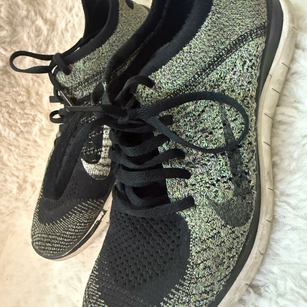 Nike Women’s Flyknit Sneakers in Black and Green
